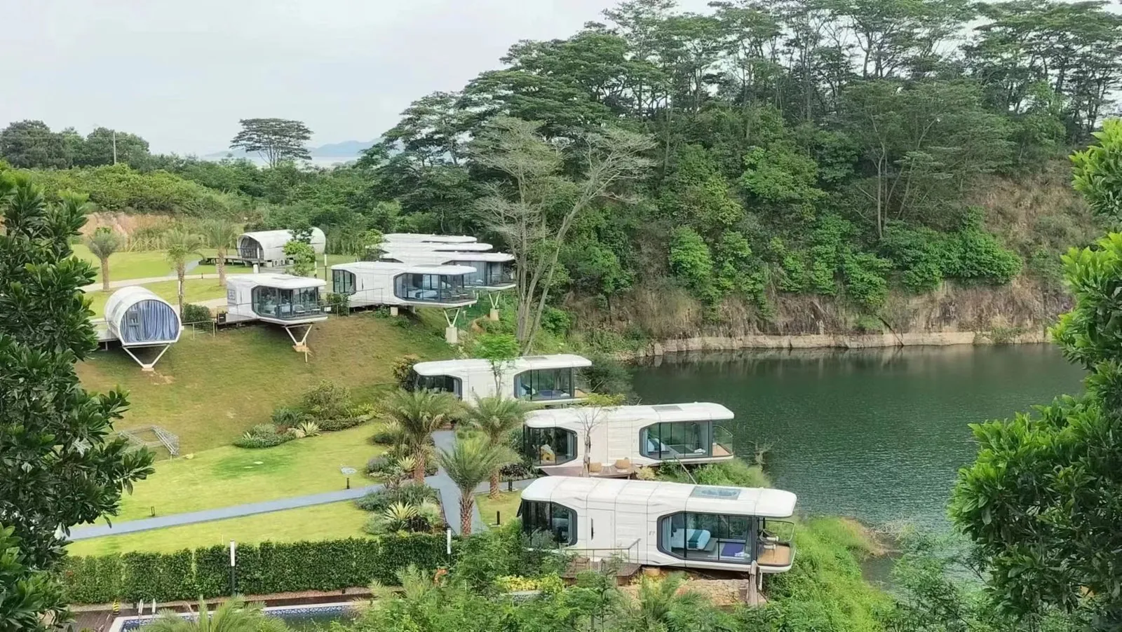 Space capsule camp by a lake