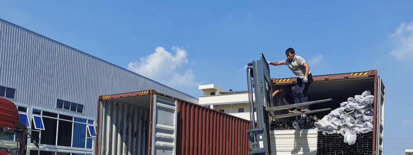 Flat-pack units packed with wood frame and corner protectors before loading